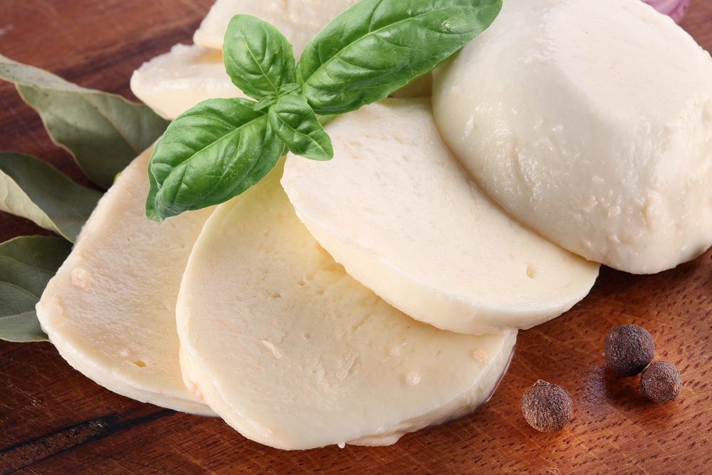 Mozzarella-cheese-and-basil-on-a-wooden-board-