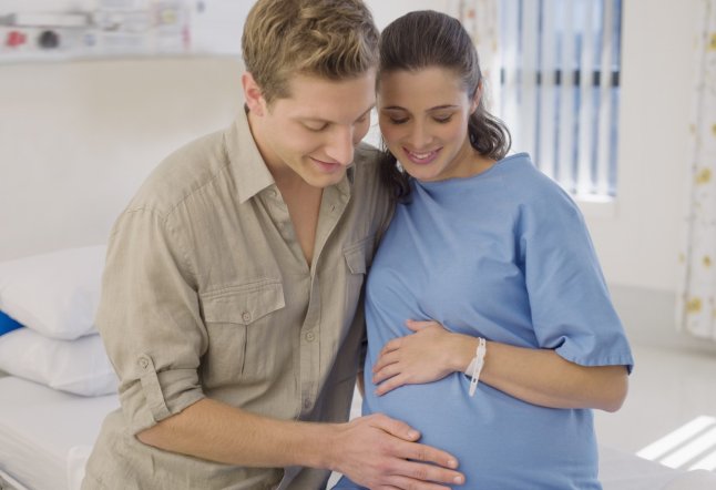 Pregnant woman and husband in hospital